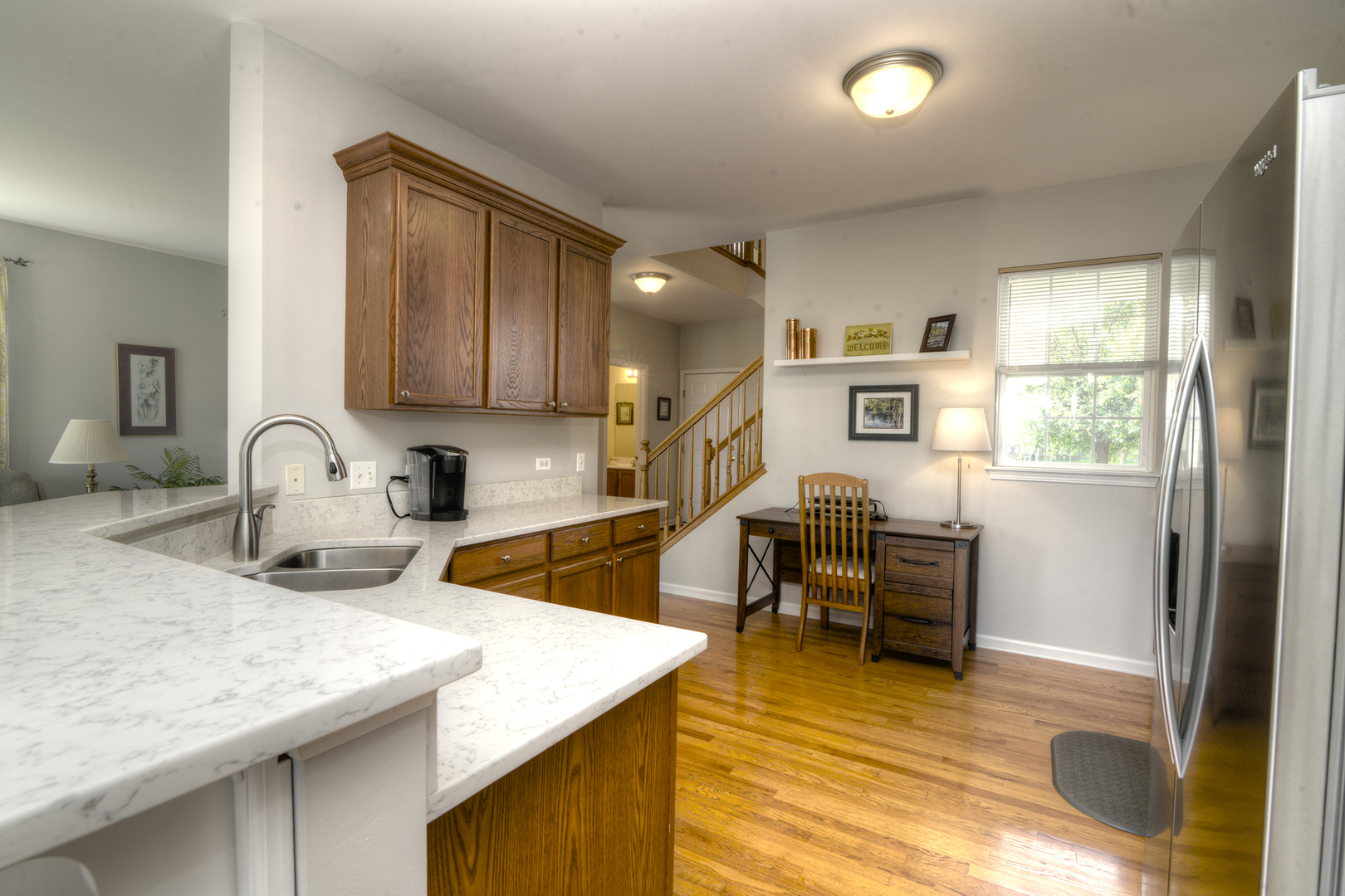 285 Ridge Road North Aurora, IL 60542 - Photo 6 of 24 a kitchen with sink refrigerator and cabinets
