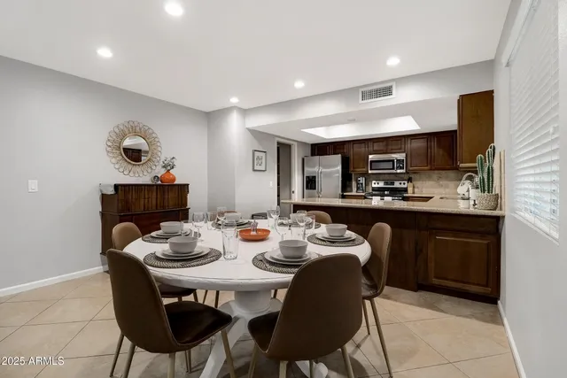 a kitchen with a table and chairs in it