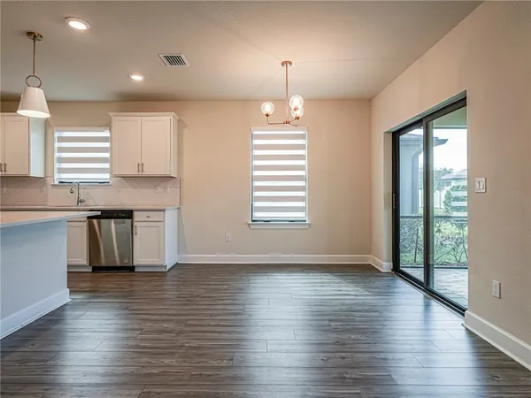 a view of a back yard from a balcony