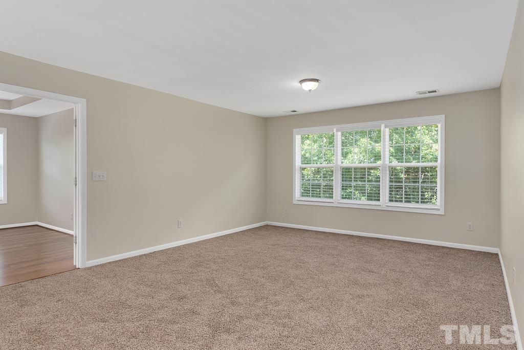110 Castlebar Lane Durham, NC 27713 - Photo 16 of 32 a view of an empty room with a window