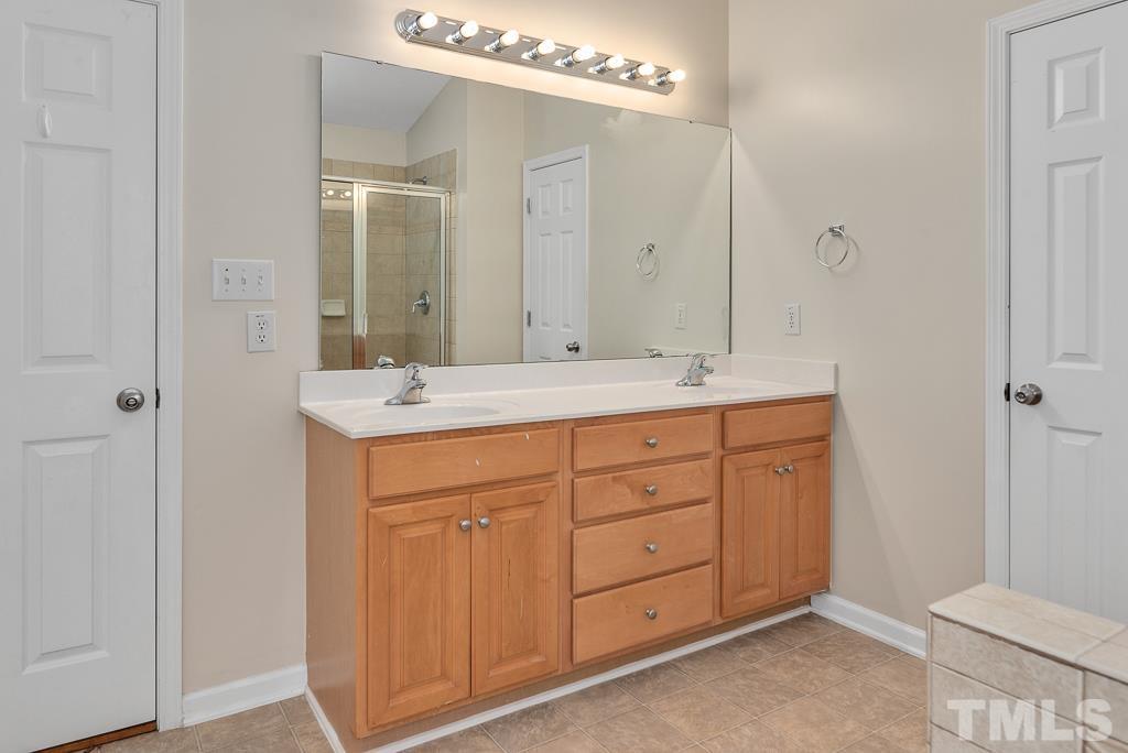 110 Castlebar Lane Durham, NC 27713 - Photo 19 of 32 a bathroom with a sink and a mirror