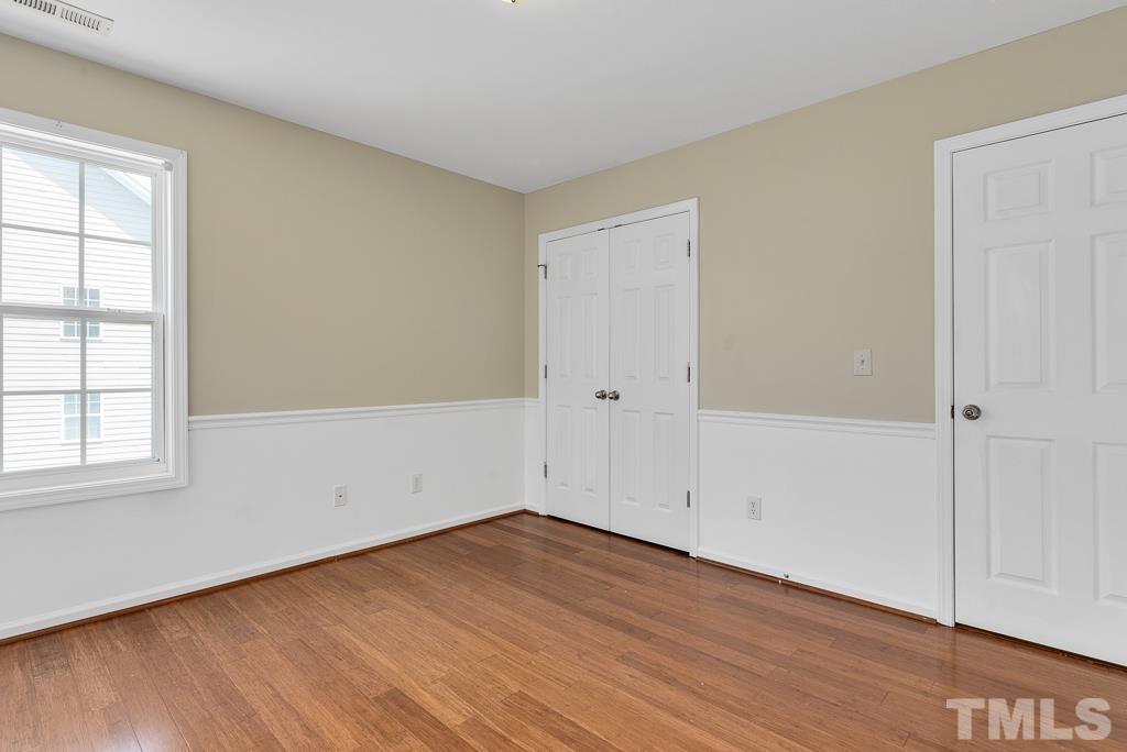 110 Castlebar Lane Durham, NC 27713 - Photo 27 of 32 an empty room with wooden floor
