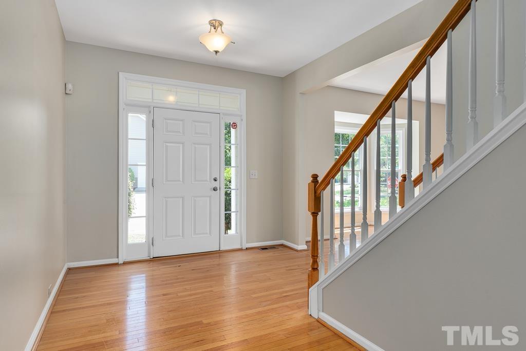 110 Castlebar Lane Durham, NC 27713 - Photo 3 of 32 a view of an entryway with wooden floor