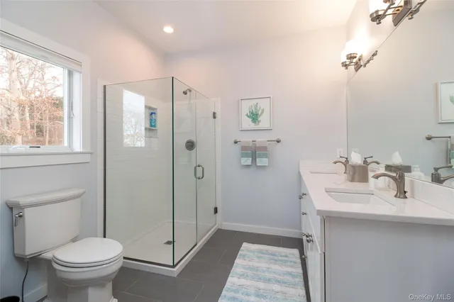 a kitchen with sink cabinets and wooden floor
