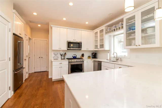 a living room with furniture flat screen tv and a fireplace