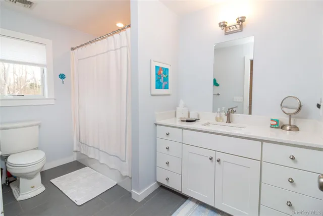 a bedroom with a bed and large window