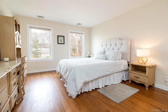 a view of a livingroom with furniture and a window