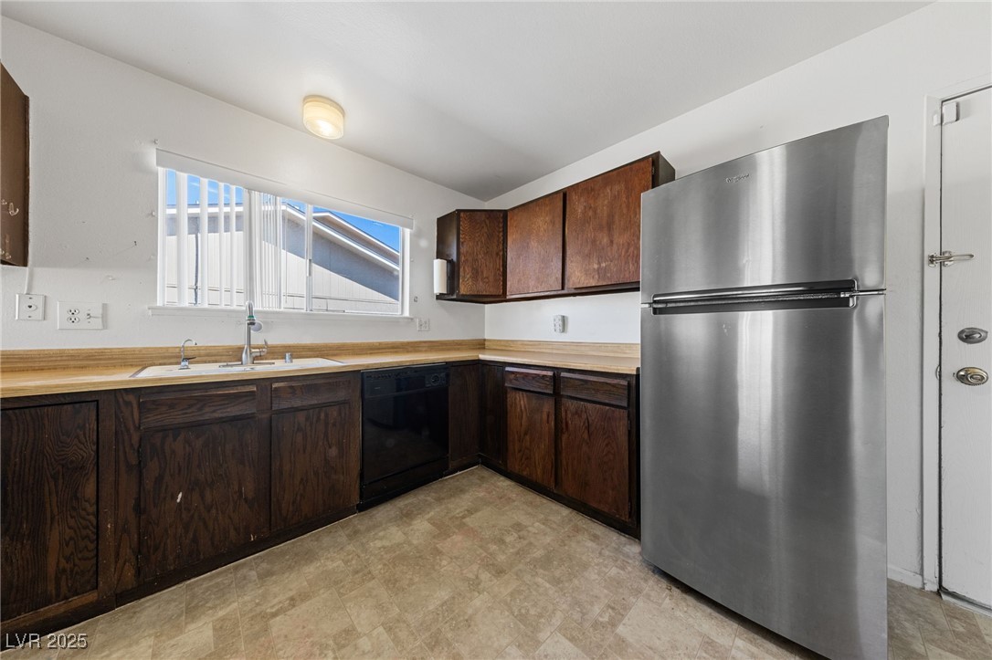 720 Sam Jonas Drive Las Vegas, NV 89145 - Photo 9 of 21 KITCHEN WITH STAINLESS REFRIGERATOR