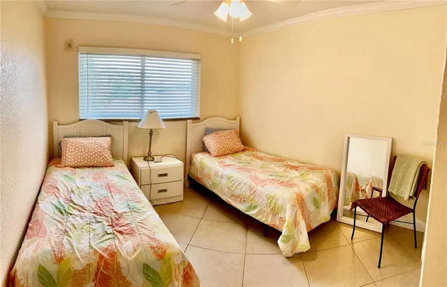 a bedroom with a bed and chair