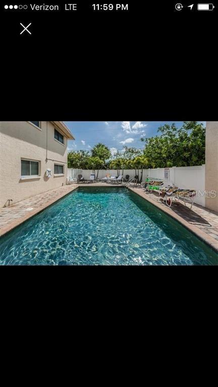 9060 Blind Pass Road, Unit 25 St. Pete Beach, FL 33706 - Photo 20 of 25 a view of outdoor space and yard