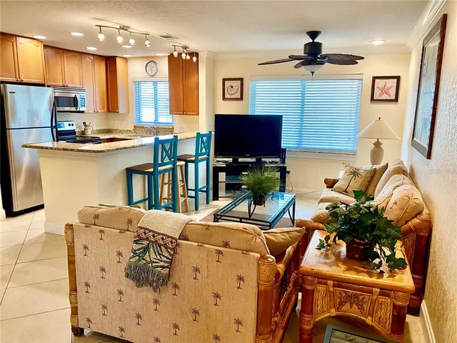 a living room with fireplace furniture and a flat screen tv