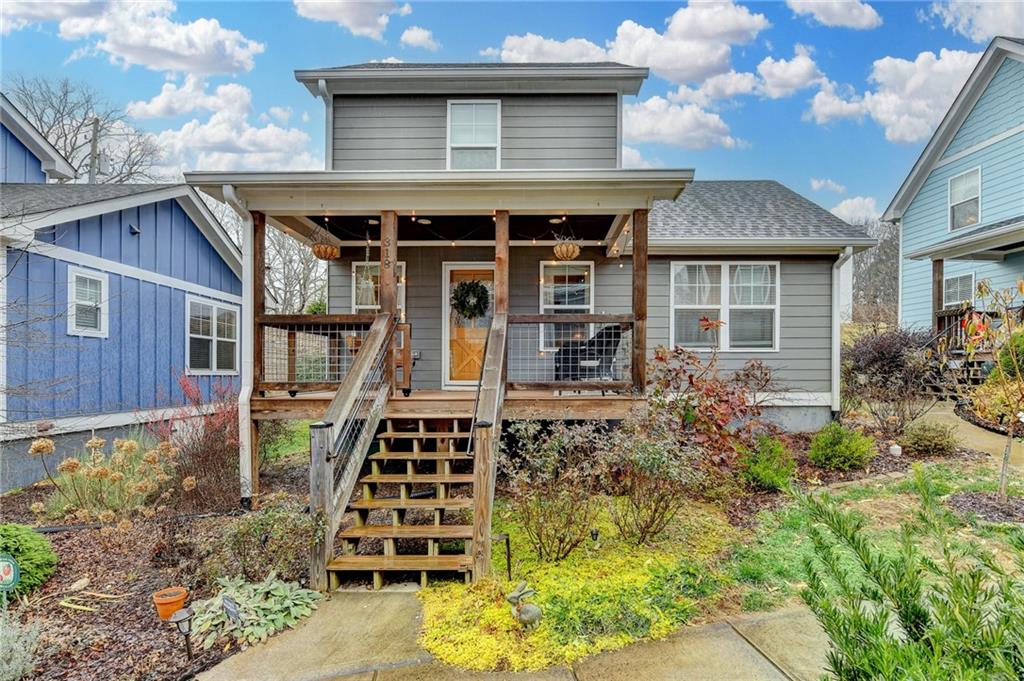 a front view of a house with garden