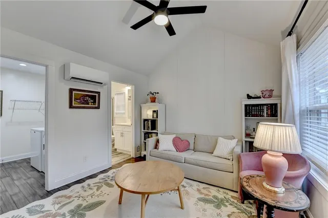 a living room with furniture and a rug