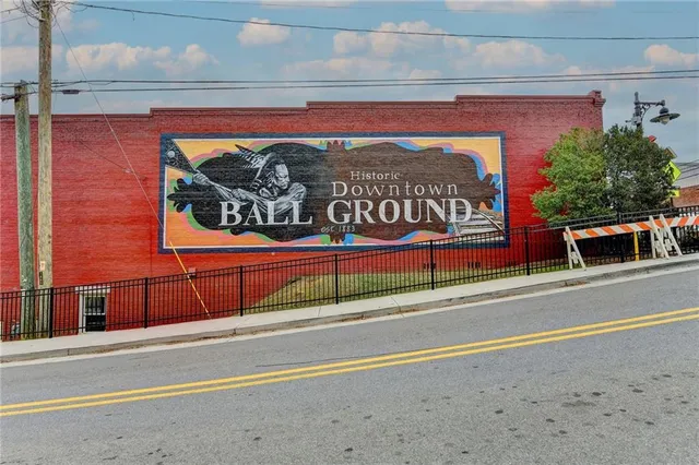 a street sign on a brick wall