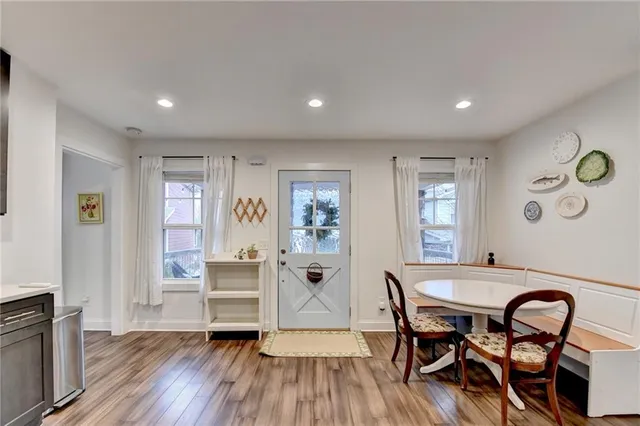 a view of a dining room with furniture and wooden floor