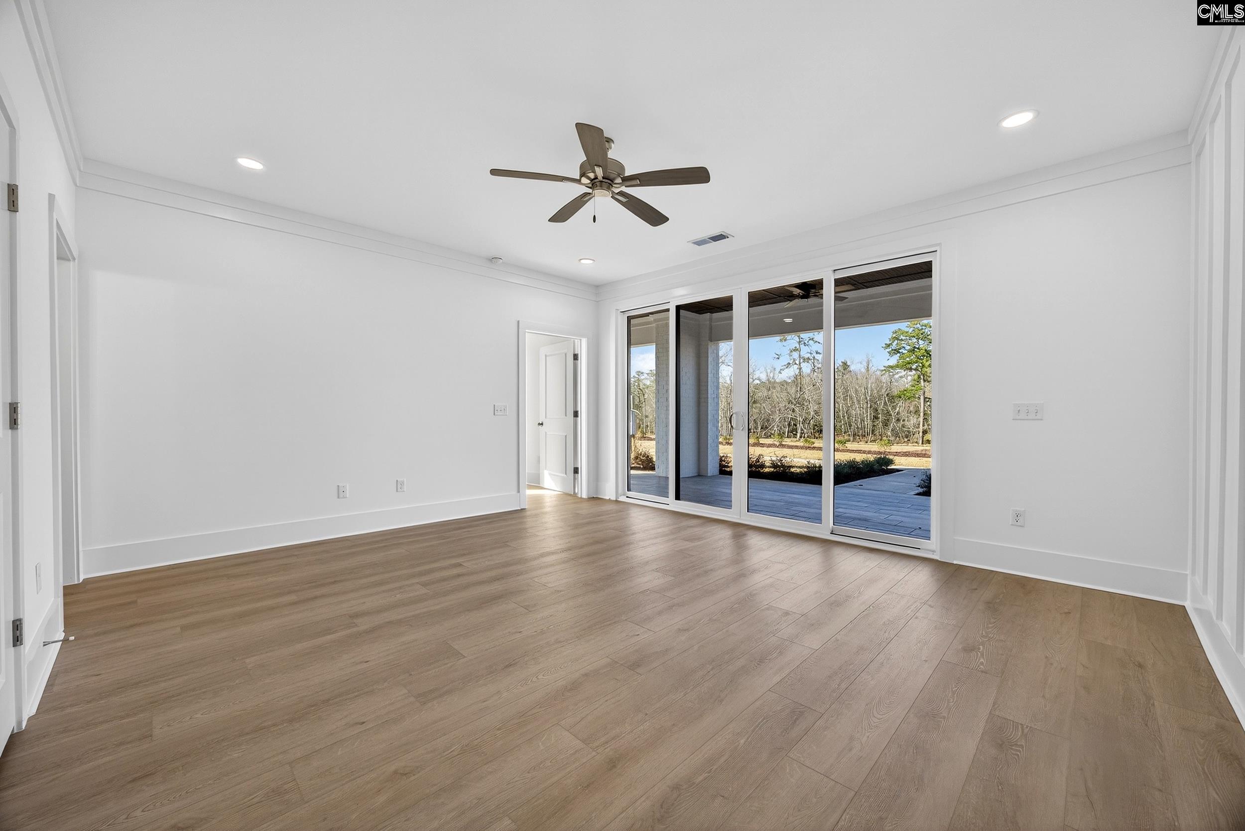 1318 Long Grove Way Lexington, SC 29072 - Photo 43 of 90 an empty room with wooden floor and windows