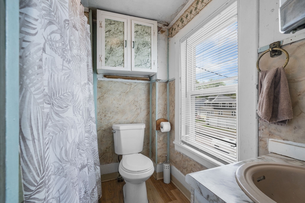 17-19 Whitehall Road Amesbury, MA 01913 - Photo 21 of 37 a bathroom with a toilet sink and mirror