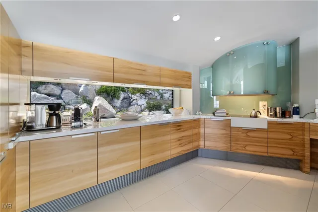 a room with lot of cabinets and washer