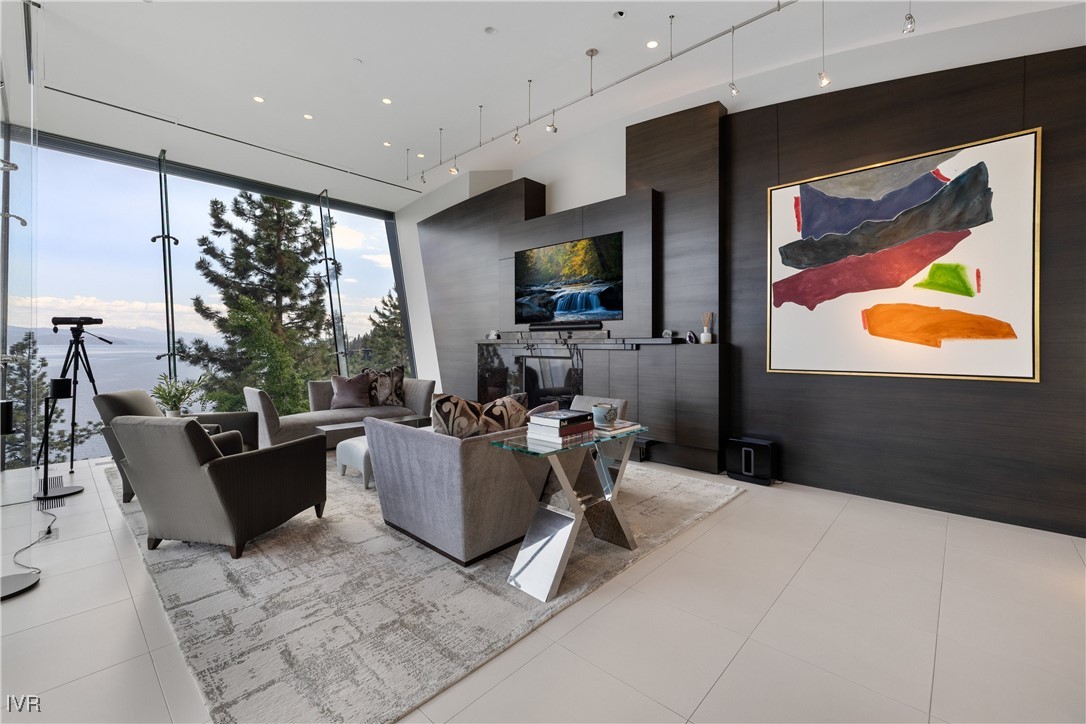 580 Gonowabie Road Crystal Bay, NV 89402 - Photo 19 of 50 a living room with couch guitar and outer view
