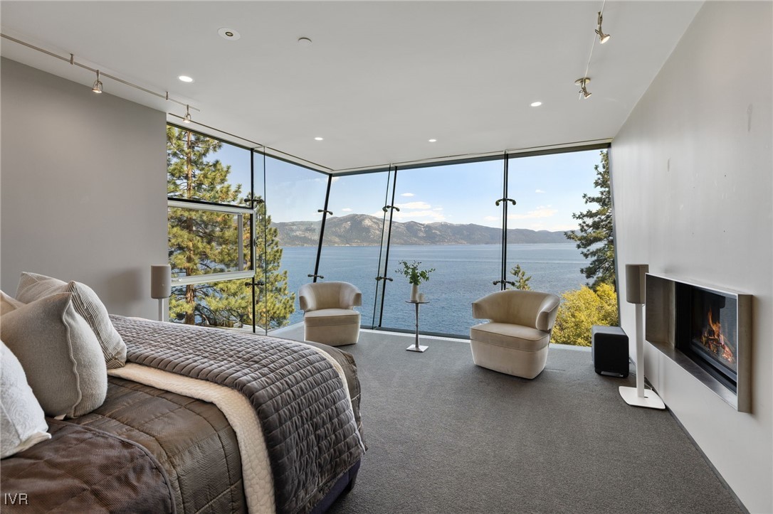 580 Gonowabie Road Crystal Bay, NV 89402 - Photo 24 of 50 a bed room with a bed and a couch