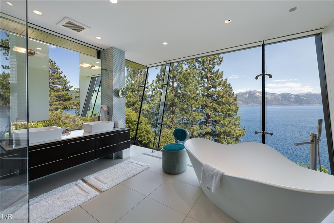 580 Gonowabie Road Crystal Bay, NV 89402 - Photo 25 of 50 a bathroom with a bathtub and a shower