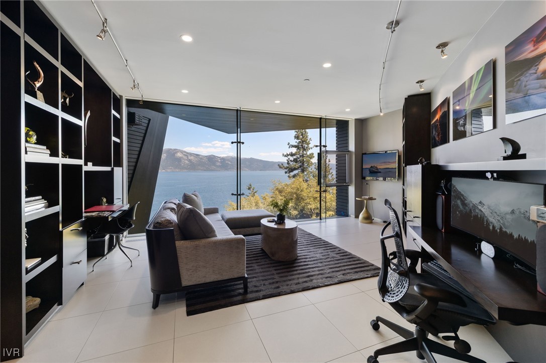 580 Gonowabie Road Crystal Bay, NV 89402 - Photo 30 of 50 a living room with furniture and a flat screen tv