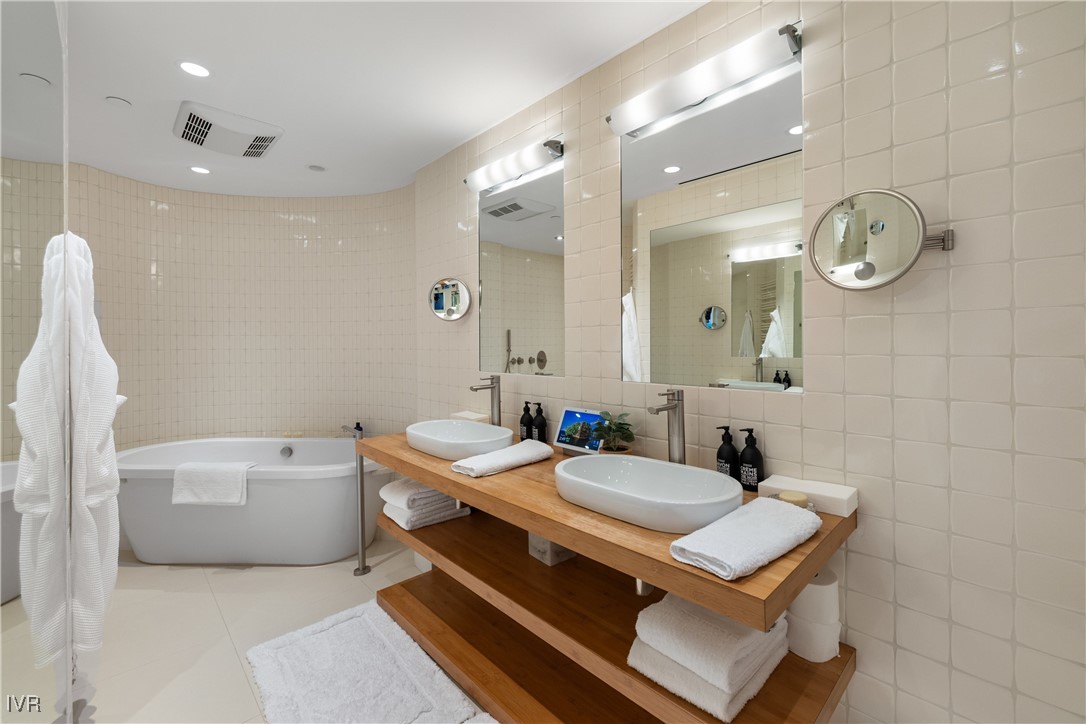 580 Gonowabie Road Crystal Bay, NV 89402 - Photo 38 of 50 a bathroom with a sink a light fixture and a mirror