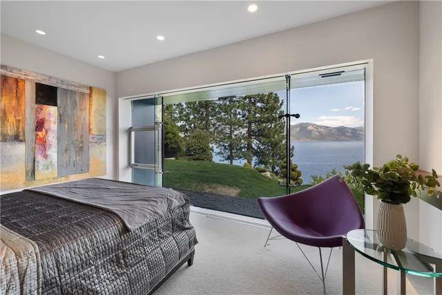 a bed sitting in a room next to a window