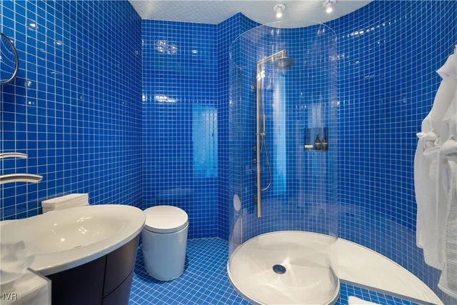 a bathroom with a toilet and a sink