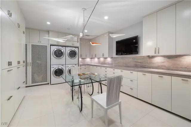 a kitchen with a sink cabinets and window