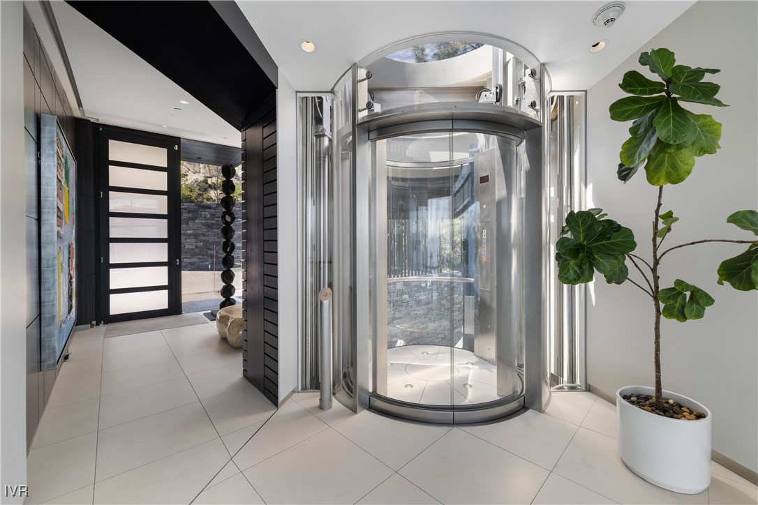 580 Gonowabie Road Crystal Bay, NV 89402 - Photo 8 of 50 a glass vase with flowers sitting on a table and a chandelier