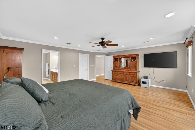1109 Overlook Terrace Union, NJ 07083 - Photo 15 of 41 a spacious bedroom with a bed and a flat screen tv