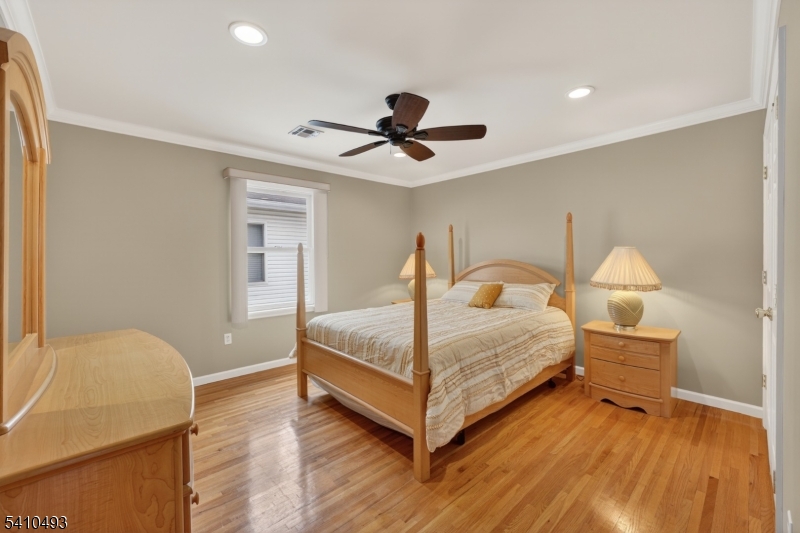 1109 Overlook Terrace Union, NJ 07083 - Photo 20 of 41 a bedroom with a bed and wooden floor