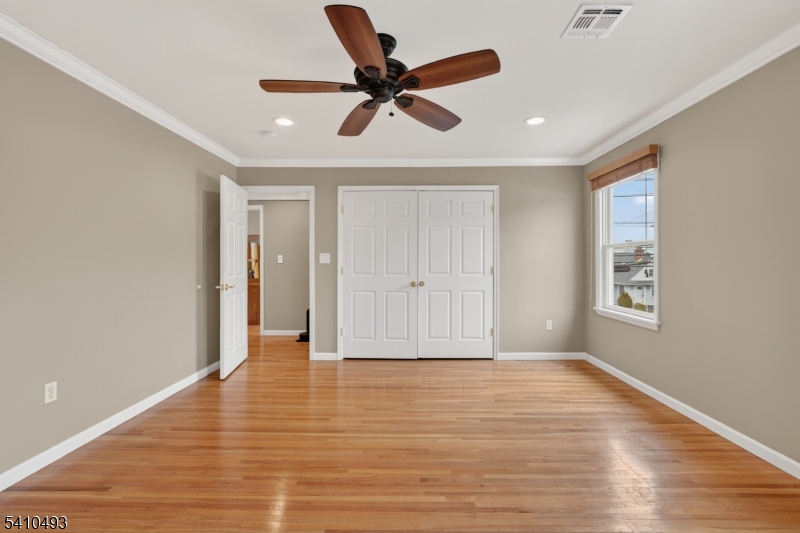 1109 Overlook Terrace Union, NJ 07083 - Photo 22 of 41 a view of empty room with wooden floor and ceiling fan