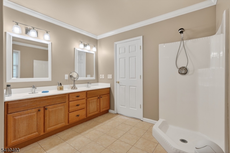 1109 Overlook Terrace Union, NJ 07083 - Photo 27 of 41 a bathroom with a double vanity sink toilet and shower
