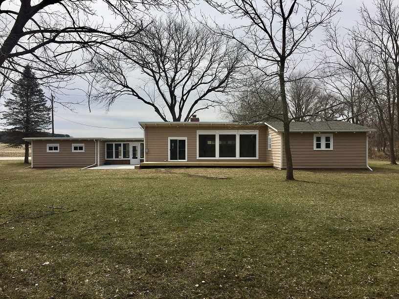 4985 Freeport Road Rockton, IL 61072 - Photo 11 of 24 a front view of a house with garden