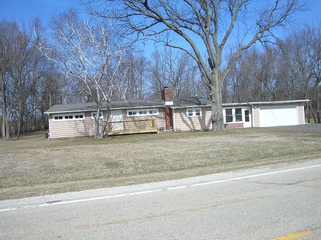 4985 Freeport Road Rockton, IL 61072 - Photo 14 of 24 a view of a house with a yard