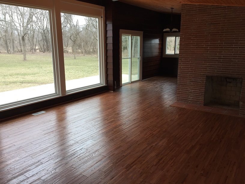 4985 Freeport Road Rockton, IL 61072 - Photo 16 of 24 a view of a livingroom with wooden floor and a fireplace