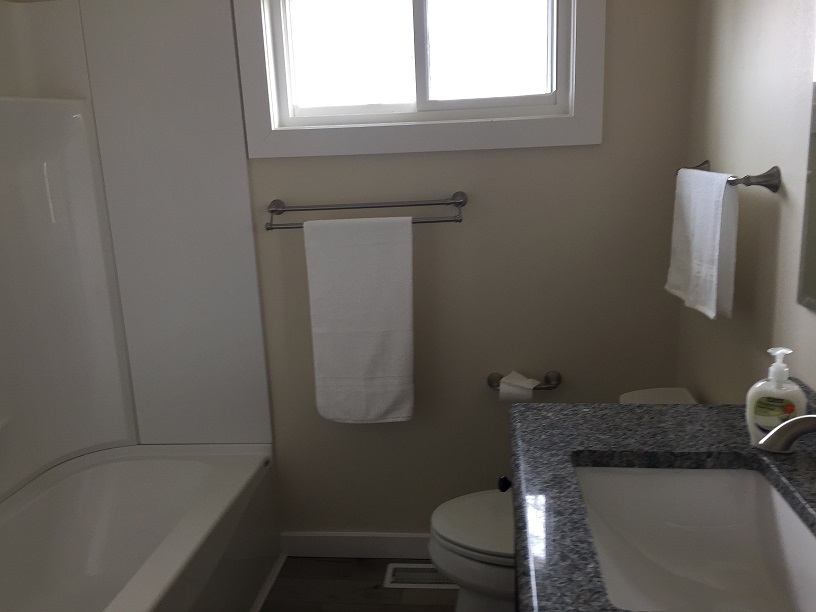 4985 Freeport Road Rockton, IL 61072 - Photo 18 of 24 a bathroom with a granite countertop toilet sink and mirror