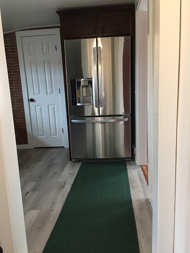 4985 Freeport Road Rockton, IL 61072 - Photo 22 of 24 a view of a kitchen from a hallway