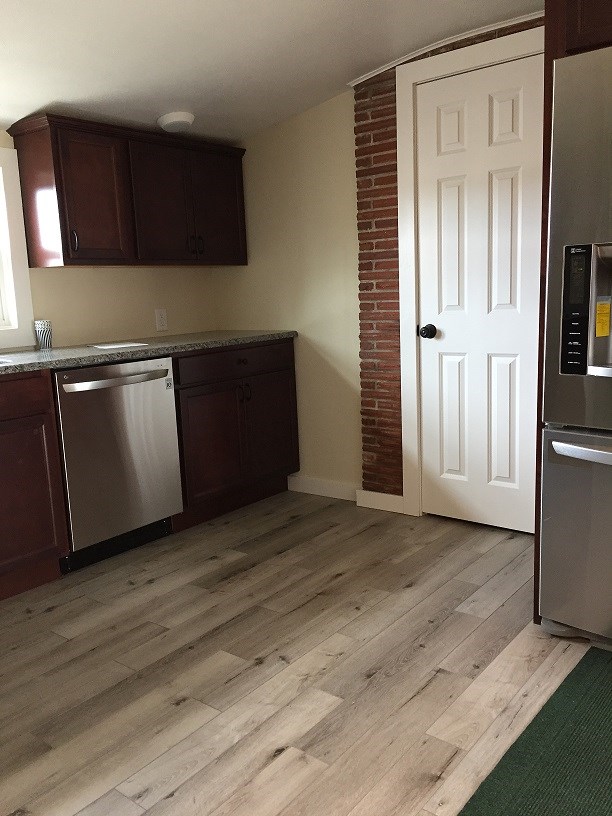 4985 Freeport Road Rockton, IL 61072 - Photo 23 of 24 a view of a kitchen with wooden floor and cabinets