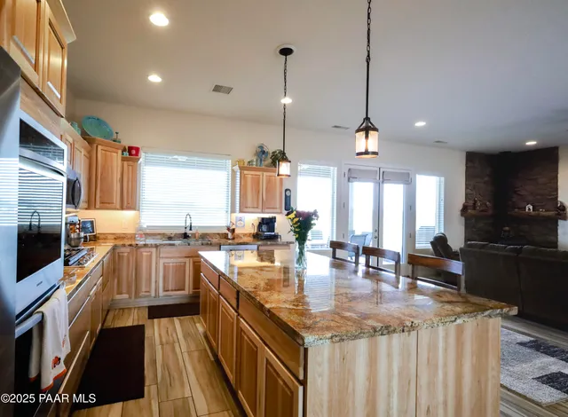 a stove top oven sitting inside of a kitchen