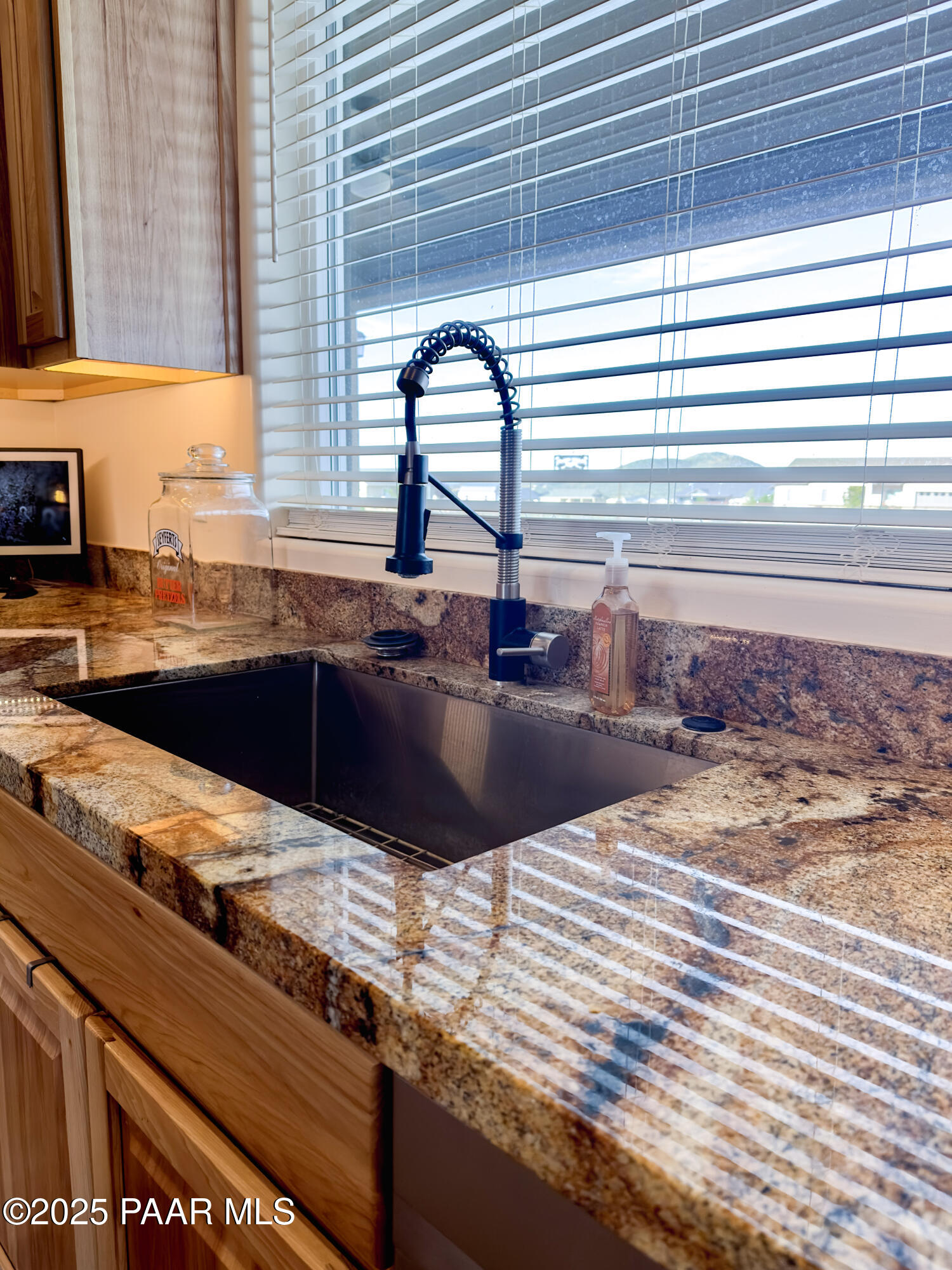 9860 North Loper Road Prescott Valley, AZ 86315 - Photo 16 of 53 a kitchen with a sink and a window