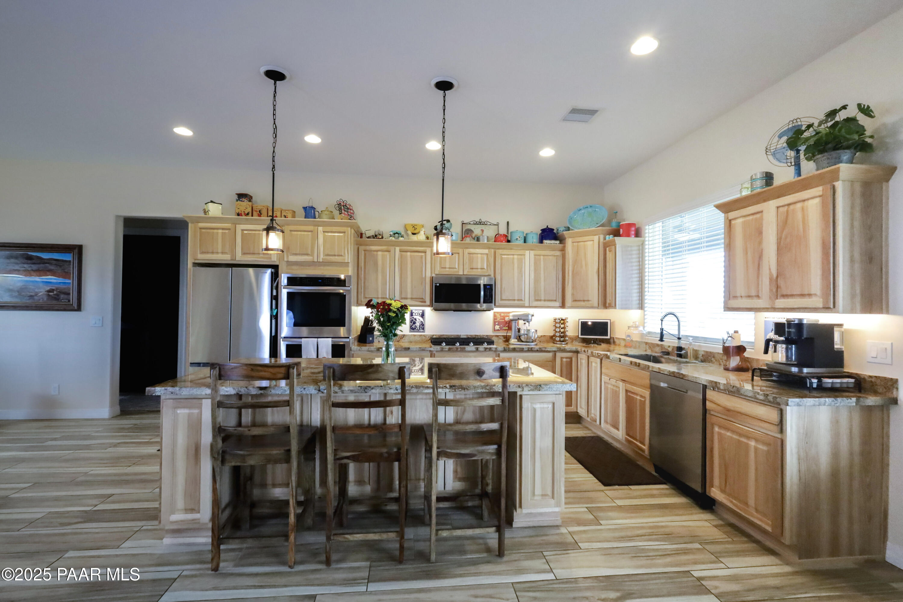 9860 North Loper Road Prescott Valley, AZ 86315 - Photo 17 of 53 a kitchen with lots of counter space and furniture