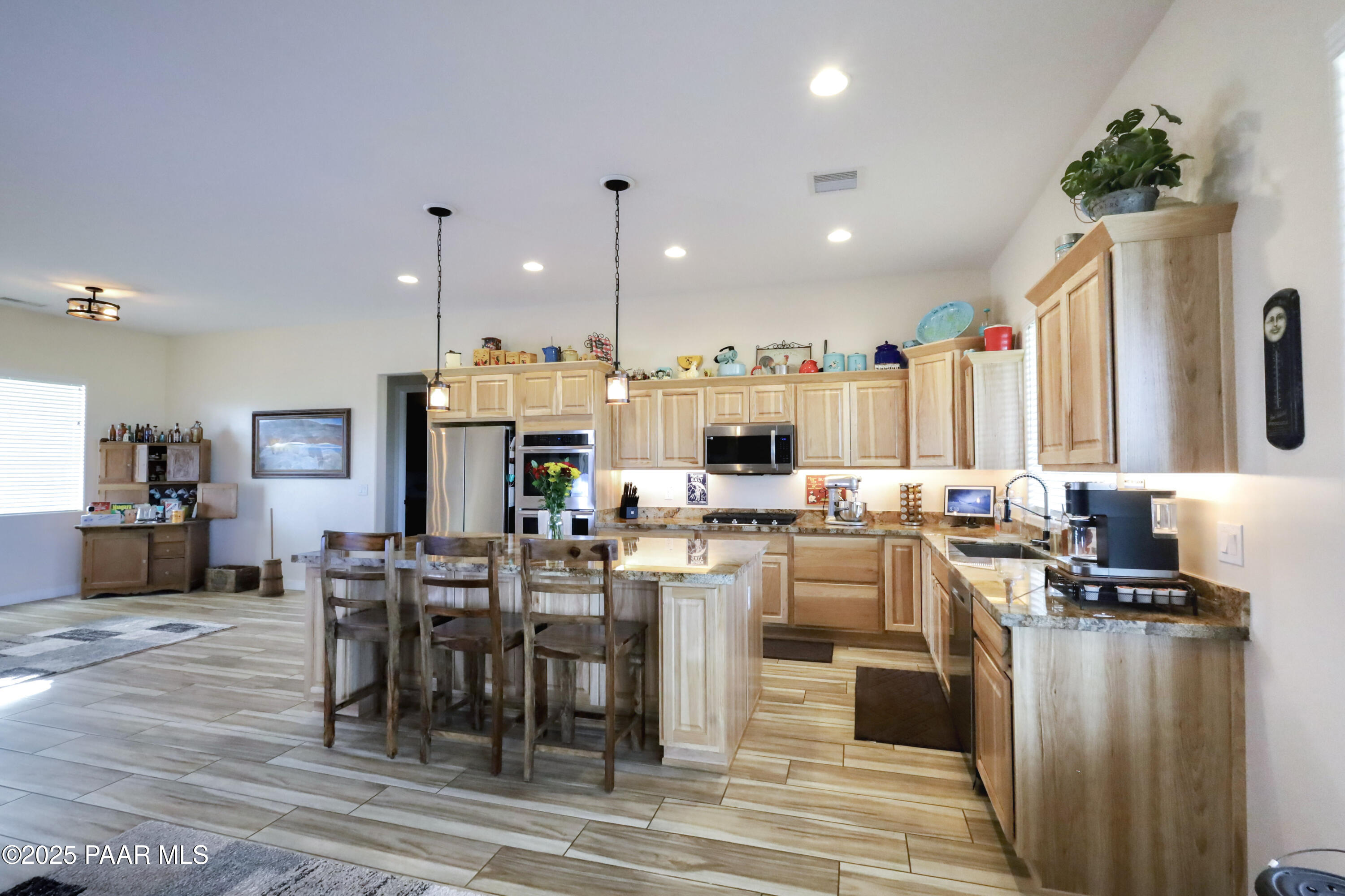 9860 North Loper Road Prescott Valley, AZ 86315 - Photo 19 of 53 a view of a dining area with furniture window and wooden floor