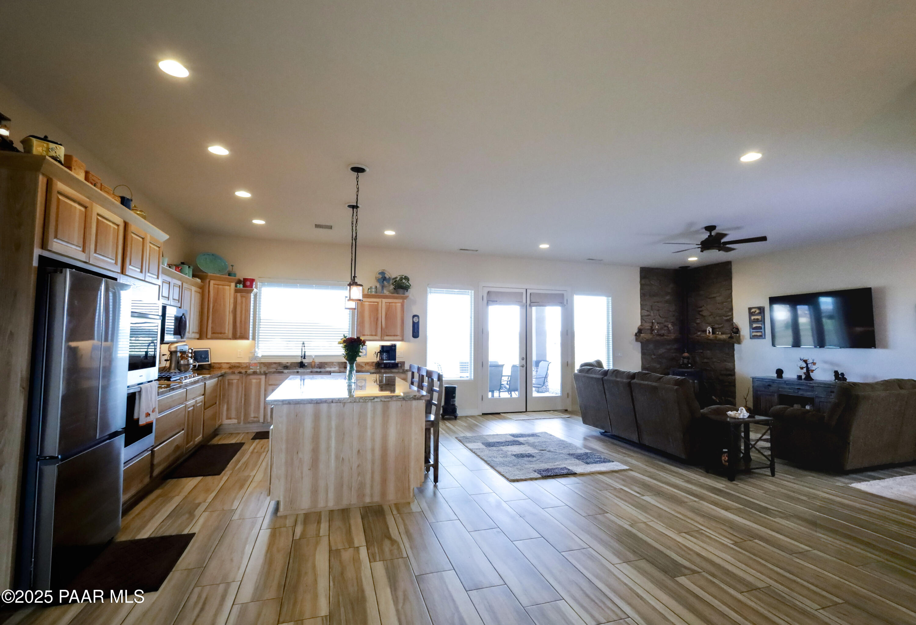 9860 North Loper Road Prescott Valley, AZ 86315 - Photo 21 of 53 a view of kitchen with cabinets stainless steel appliances dining table and chairs