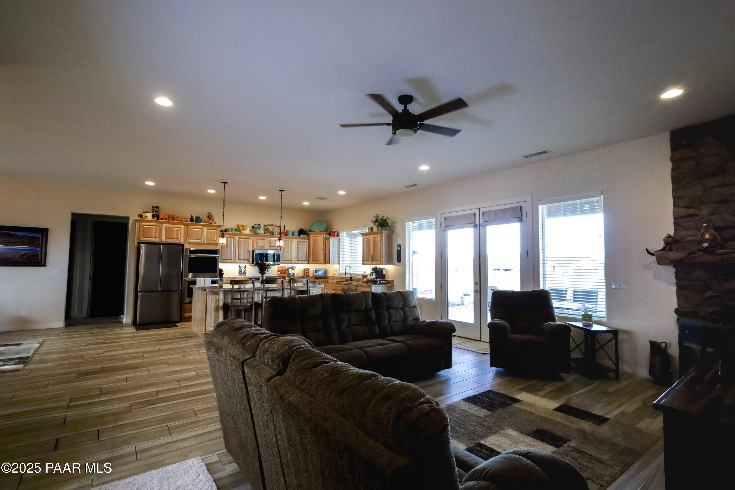 9860 North Loper Road Prescott Valley, AZ 86315 - Photo 27 of 53 a living room with furniture and a flat screen tv