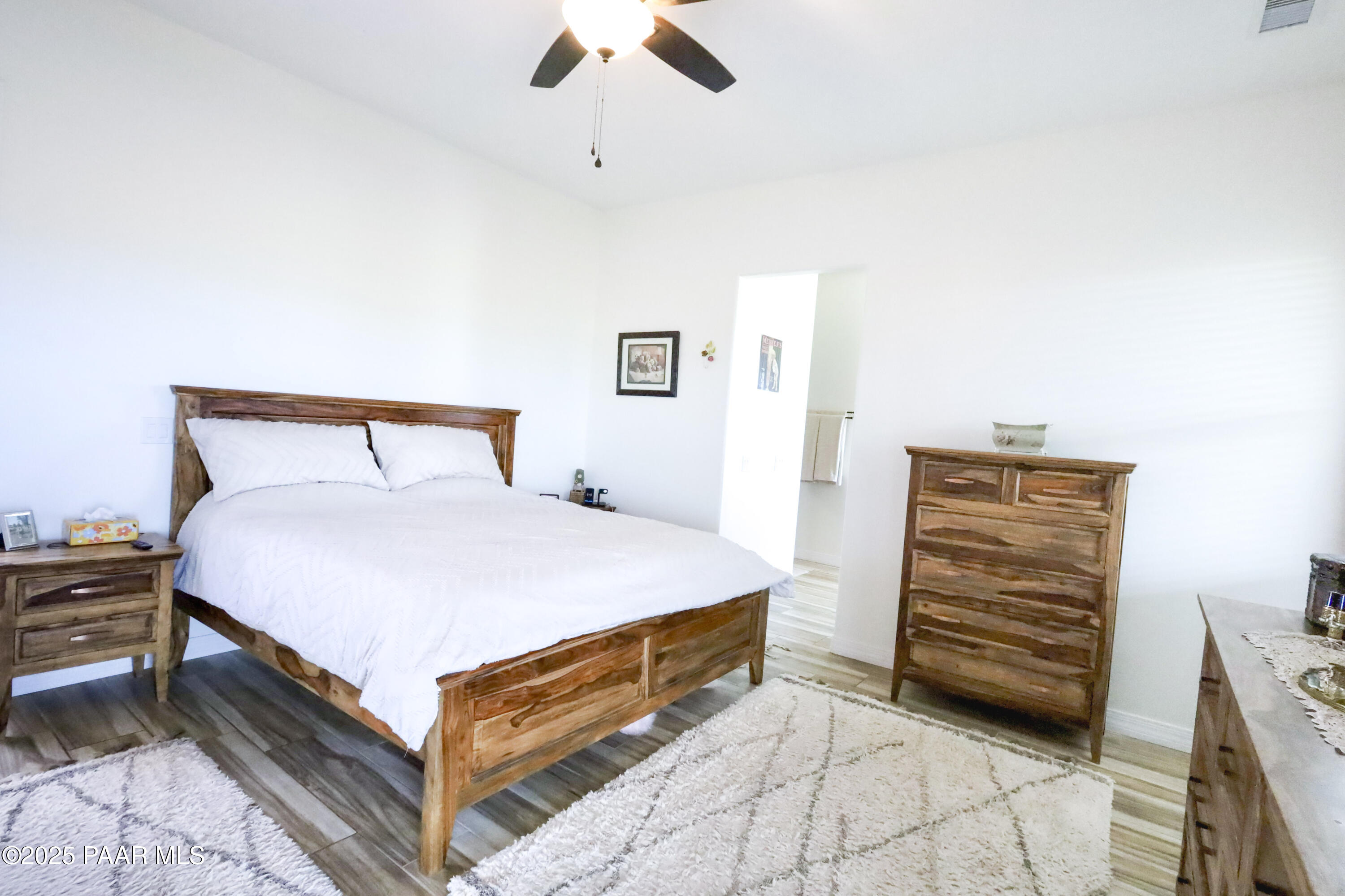9860 North Loper Road Prescott Valley, AZ 86315 - Photo 35 of 53 a bedroom with a bed and a dresser