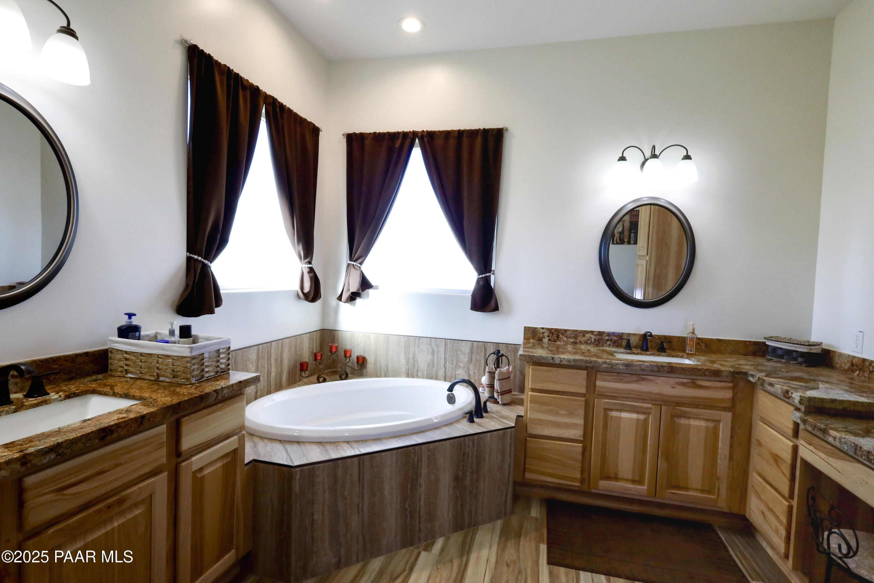 9860 North Loper Road Prescott Valley, AZ 86315 - Photo 37 of 53 a bathroom with a double vanity sink and a mirror