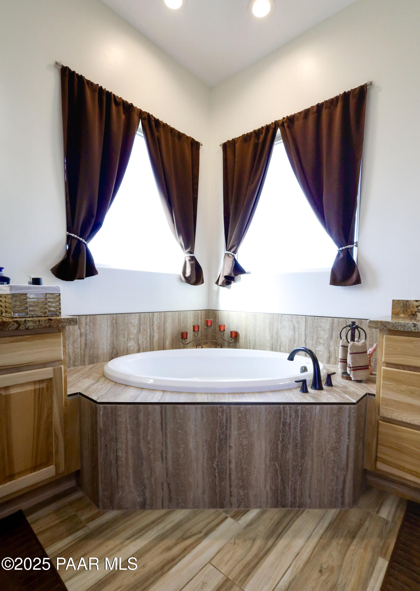 9860 North Loper Road Prescott Valley, AZ 86315 - Photo 39 of 53 a kitchen with stainless steel appliances a sink a stove and white cabinets